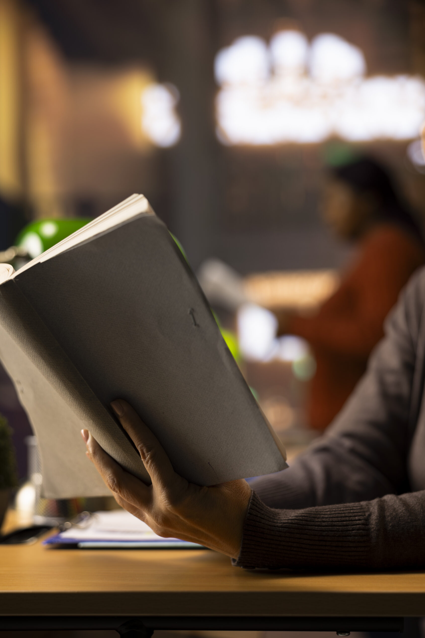 Ambitious female student working on her thesis in a campus library study area